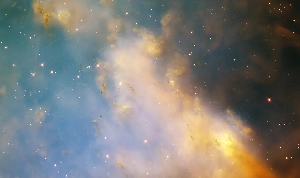 Reference image of the Dumbbell Nebula (M27) from Hubble showing knots of glowing gas ejected from a dying star