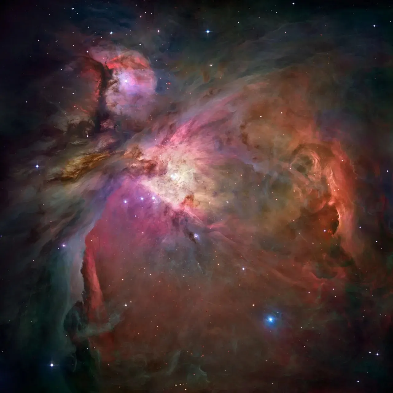 Reference image of the Orion Nebula (M42) from Hubble showing the colourful nebulosity around the central star-forming region