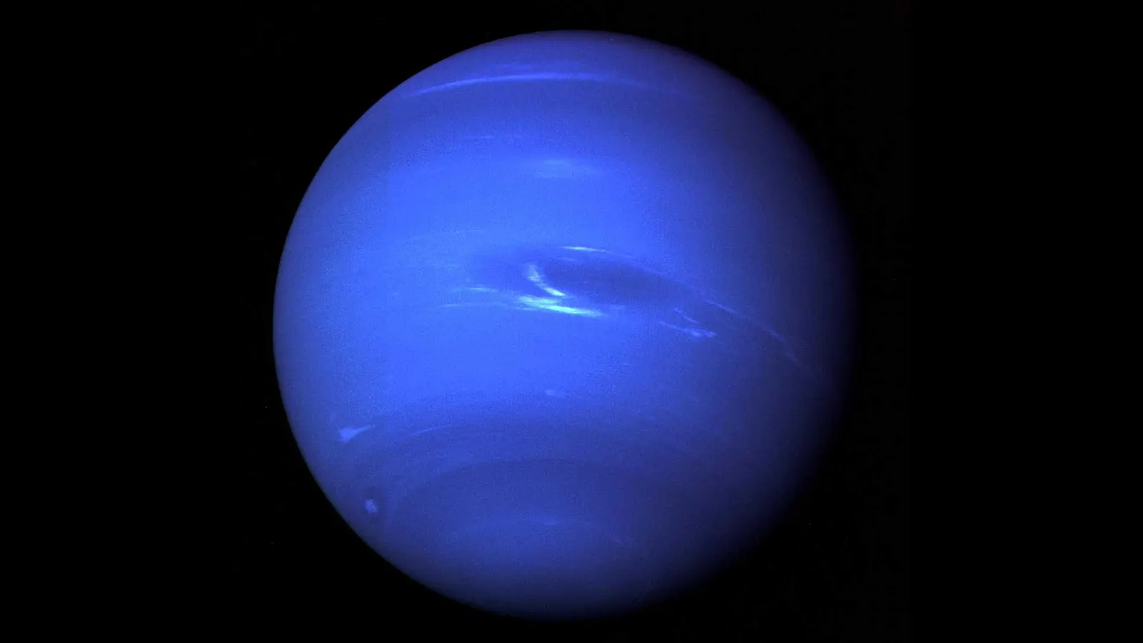 Reference image of Neptune's full disk from Voyager 2, showing the deep-blue atmosphere